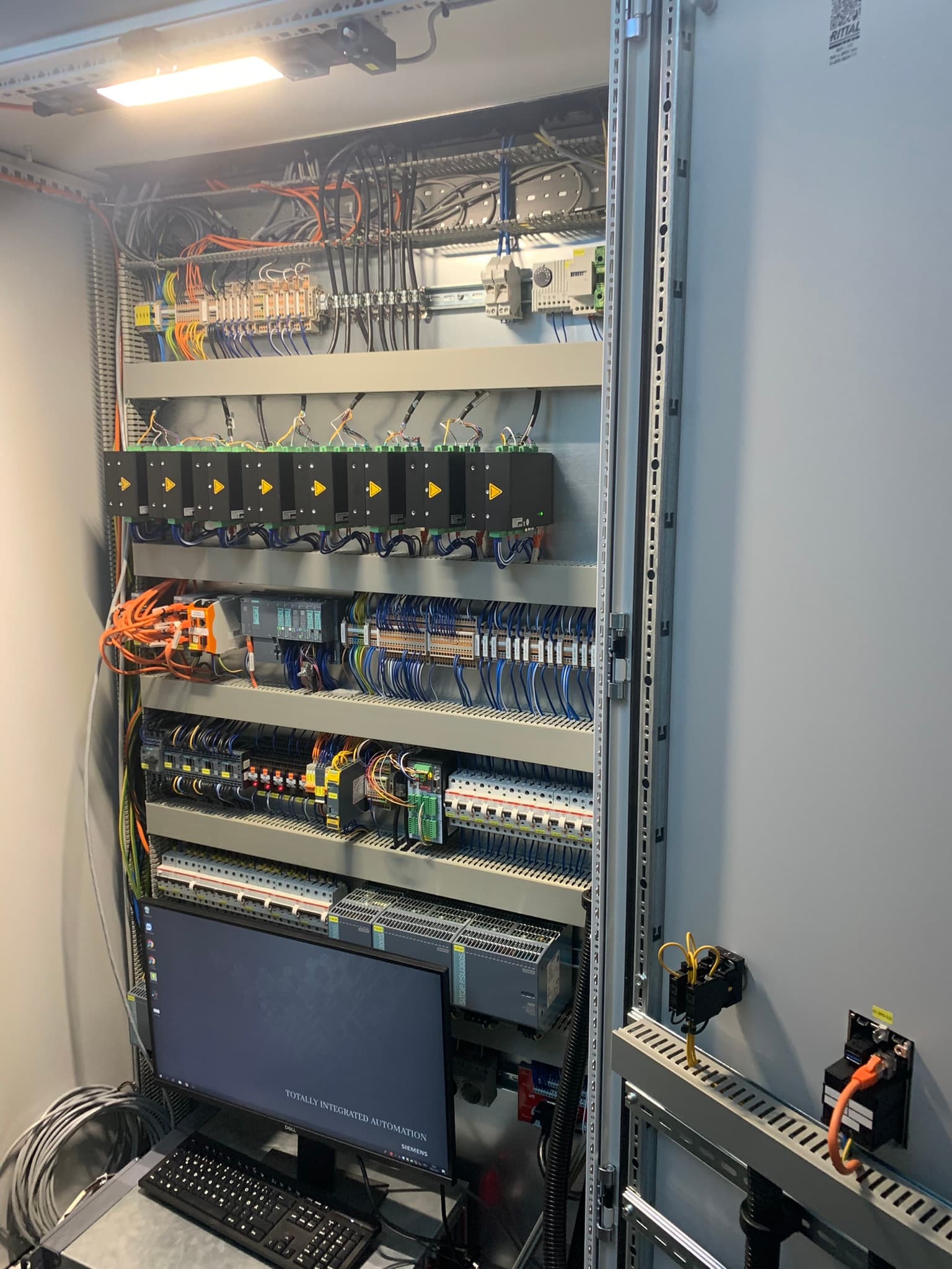 Industrial control cabinet wired for vInspect signal service and PLC integration