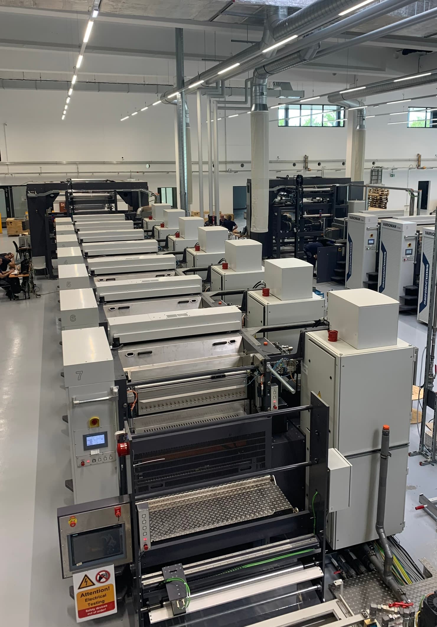 Multi-stage flexo press hall with vInspect inspection bridges installed across the line